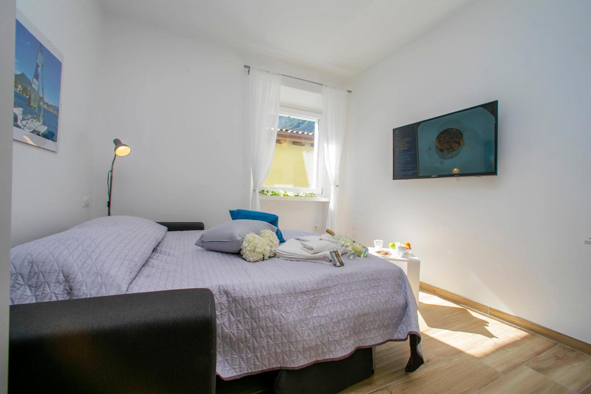 Nido Sui Tetti Di Riva Del Garda - Happy Rentals Exterior foto